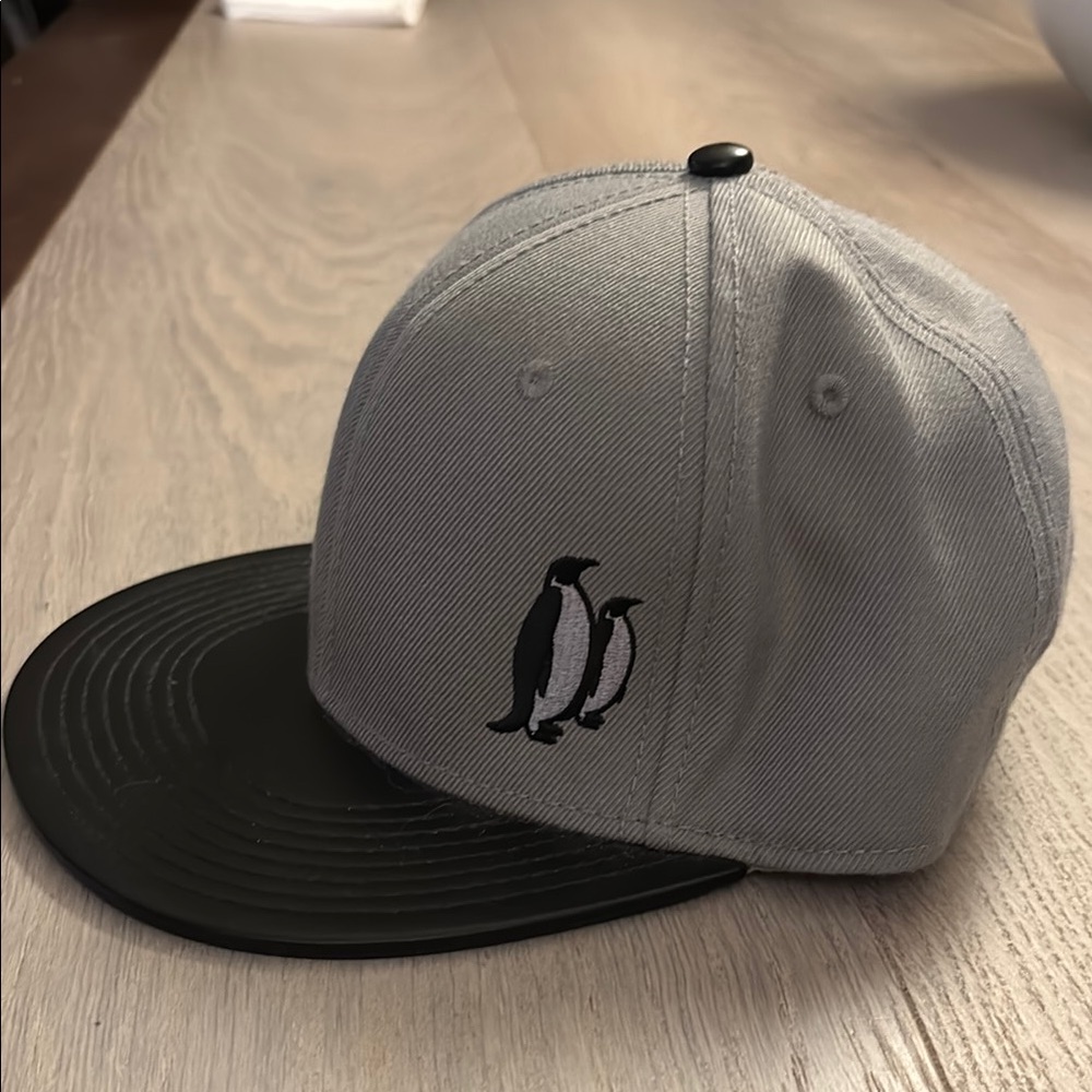 Otto Gray and Black Penguin Logo